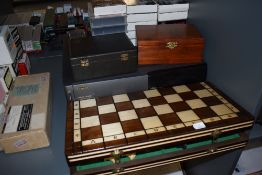 Three modern Chess sets, one in a Jaques box, a selection of Chess related video cassettes and a