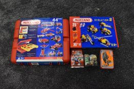 Two modern Meccano part sets, 7064 and Evolution 2 along with a Design Starter set and two Lego