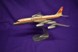 A Professional desk top diecast Swissair passenger aircraft model, on aluminium stand,