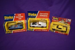 Three Dinky diecasts, Corvette Stingray 221, VW Porsche 914, and Purdey's TR7 112, all in original