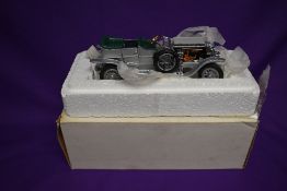 A Franklin Mint 1:24 scale diecast model, 1907 Rolls Royce Silver Ghost, in original polystyrene