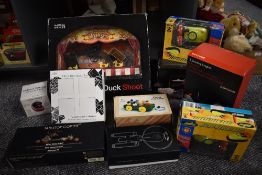 A shelf of modern toys including Marks & Spencer Duck Shot, John Lewis 2 Jousting Knights,