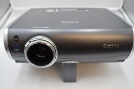 A Canon XEED SX50 multimedia projector with remote control in a Pelican 1600 hard case