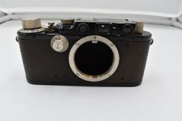 A Leica 1F camera body in leather case Circa 1933. Serial No 109925