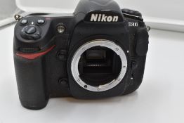 A Nikon D300 camera body in original box with manual