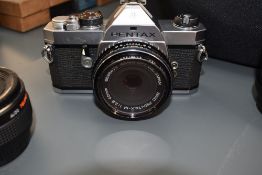 A Pentax MX with 40mm, Pentax M lens, Pentax m 80-200mm lens, a Sigma UC Zoom 28-105mm, Pentax M