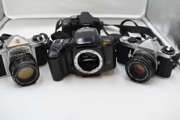 Four cameras, a Pentax S3 with Auto/Takumar 55mm lens, a Pentax Z-20 body, a Pentax ME Super, and