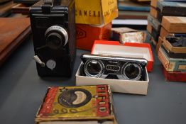 A Dekko cine camera in original box, a pair of pocket binoculars in original box etc SELLING IN