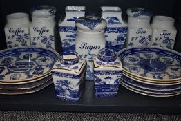 A selection of blue and white wear ceramics including Ringtons vase and caddy pairs