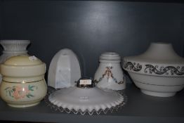 A selection of Art Deco and later pressed glass light shades including ribbon design and hand