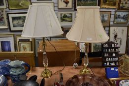 A pair of brass effect table lamps