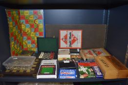 A selection of travel and table top childrens board games including Monopoly and Snakes and ladders