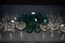 A selection of clear cut and crystal glass wares including star etched cocktail glasses and