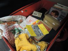 A red suitcase and a selection of 45rpm singles