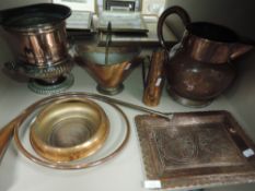 An assortment of copper items including large jug, horn,bowl and ice bucket.