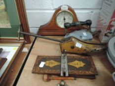 A selection of vintage items including iron,tie press and shoe last, also incuded is an assortment