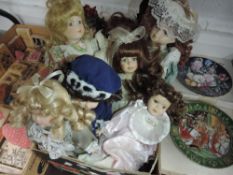 A box full of collectable dolls.