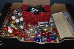 A selection of christmas decorations including glass and similar