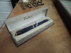 A vintage navy blue Parker Slimfold 6 fountain pen having Single decorative band to cap with