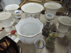 A selection of Wedgwood rose vases, two planters , two candlesticks and more.