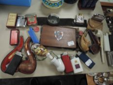 A selection of vintage and retro lighters,pipes, cigarette cases and vesta case and similar.