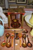 A collection of painted wooden items including stool,bowls and spoons.