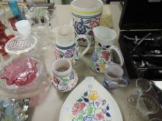 Six items of Poole pottery including vases,jugs and plate.