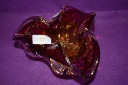 An art glass bowl heavy set with splash design having yellow to cranberry colour way