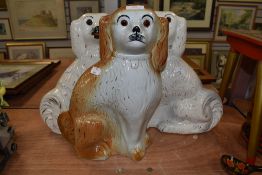 Three larger Staffordshire dogs having glass eyes.