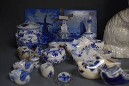 A selection of blue and white wear ceramics in Dutch delft designs including tiles
