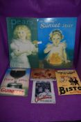 A selection of reproduction tinplate style signs including Guinness and Sunset Jelly