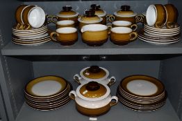 A large part dinner and tea service by Denby in a brown and cream colour way
