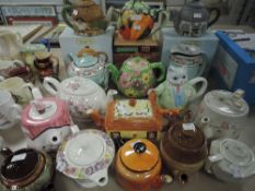 A collection of vintage and retro teapots including novelty examples.