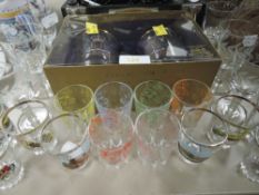 A set of commemorative golden jubilee glasses in box, a variety of mid century shot glasses also
