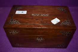 An antique tea caddy having mother of pearl and metal inlay and banding with good inner