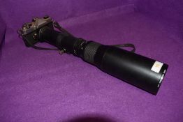 A Fujica ST705W camera and telescopic Paragon 500mm lens.