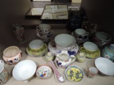 A selection of vintage oriental and oriental styled ceramics including tea pot,cup and saucers and