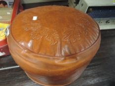 a vintage 60's styled leather foot stool or puffe