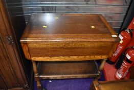 A mid 20th Century oak Priory style tea trolley