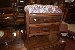 An early 20th Century stained frame piano stool, later upholstery to top, double drawer base