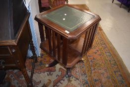 A reproduction Regency style revolving bookcase, width approx. 50cm, having brass claw feet