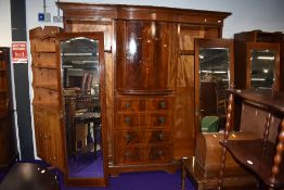 An early 20th Century mahogany and inlaid wardrobe/press of large proportions, labelled Maple and