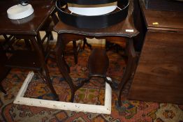 An Edwardian mahogany occasional table, shaped top approx. 74 x 42cm, damage to one corner