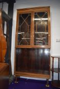 An early 20th Century stripped mahogany bookcase with open shelves under