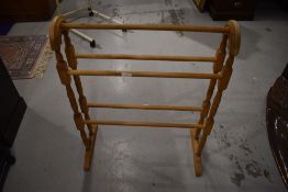 A traditional Victorian style turned towel rail