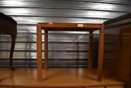 A vintage occasional table, teak effect, probably part of a nest originally