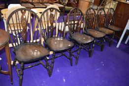 A set of six vintage wheelback dining chairs
