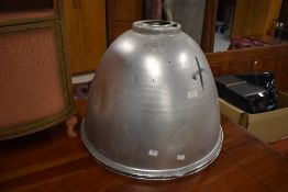 A pair of industrial aluminium light shades