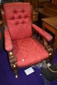 A 19th Century armchair having later red damask upholstery