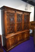 A reproduction concave bookcase by Bevan Funnel , width approx.178cm
